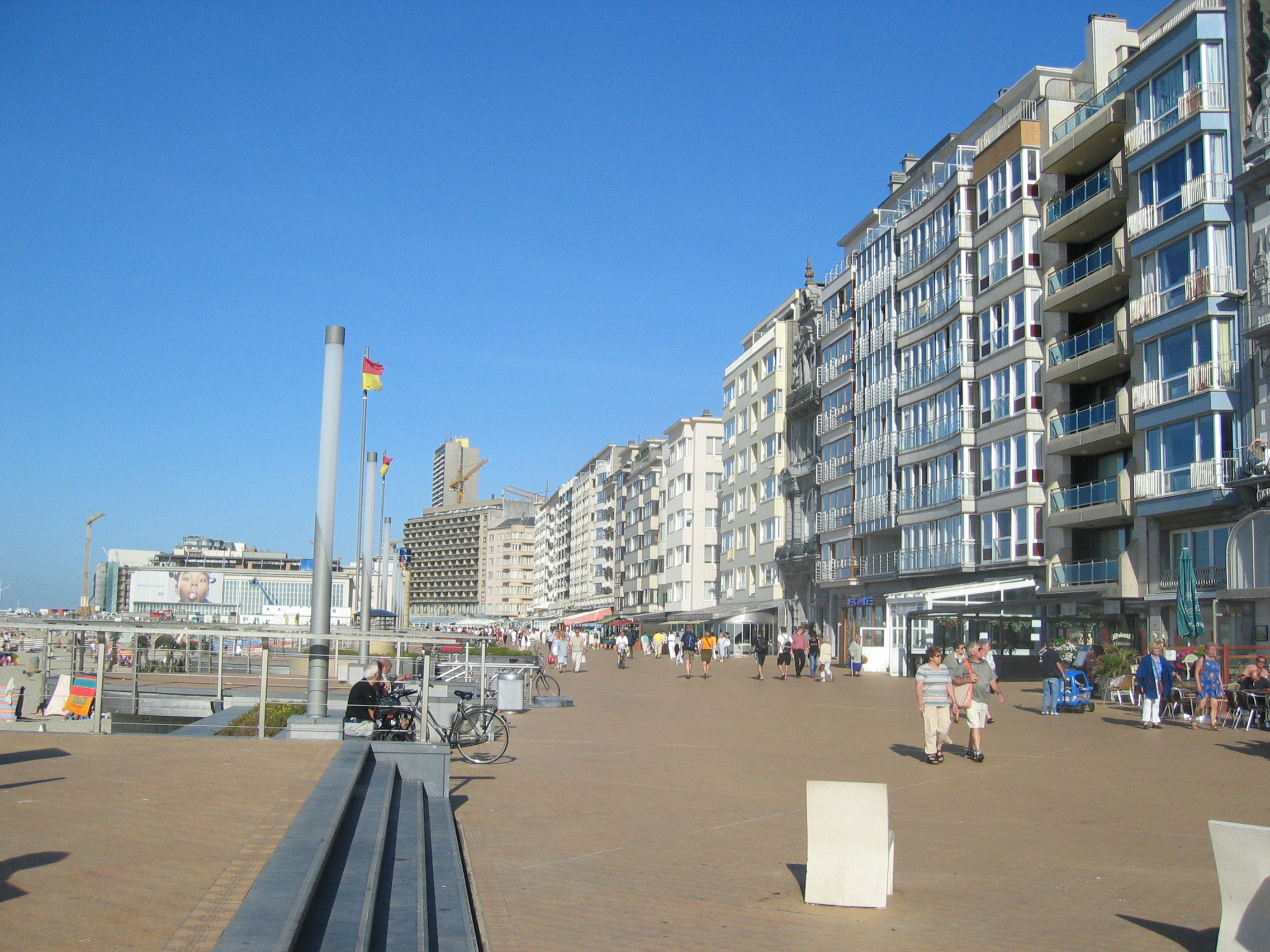 Jan Fabre's bronze Searching for Utopia (2003) on the seafront at Nieuwpoort — the most-photographed permanent commission of the Beaufort Triennial and a founding emblem of the Beaufort Sculpture Park.