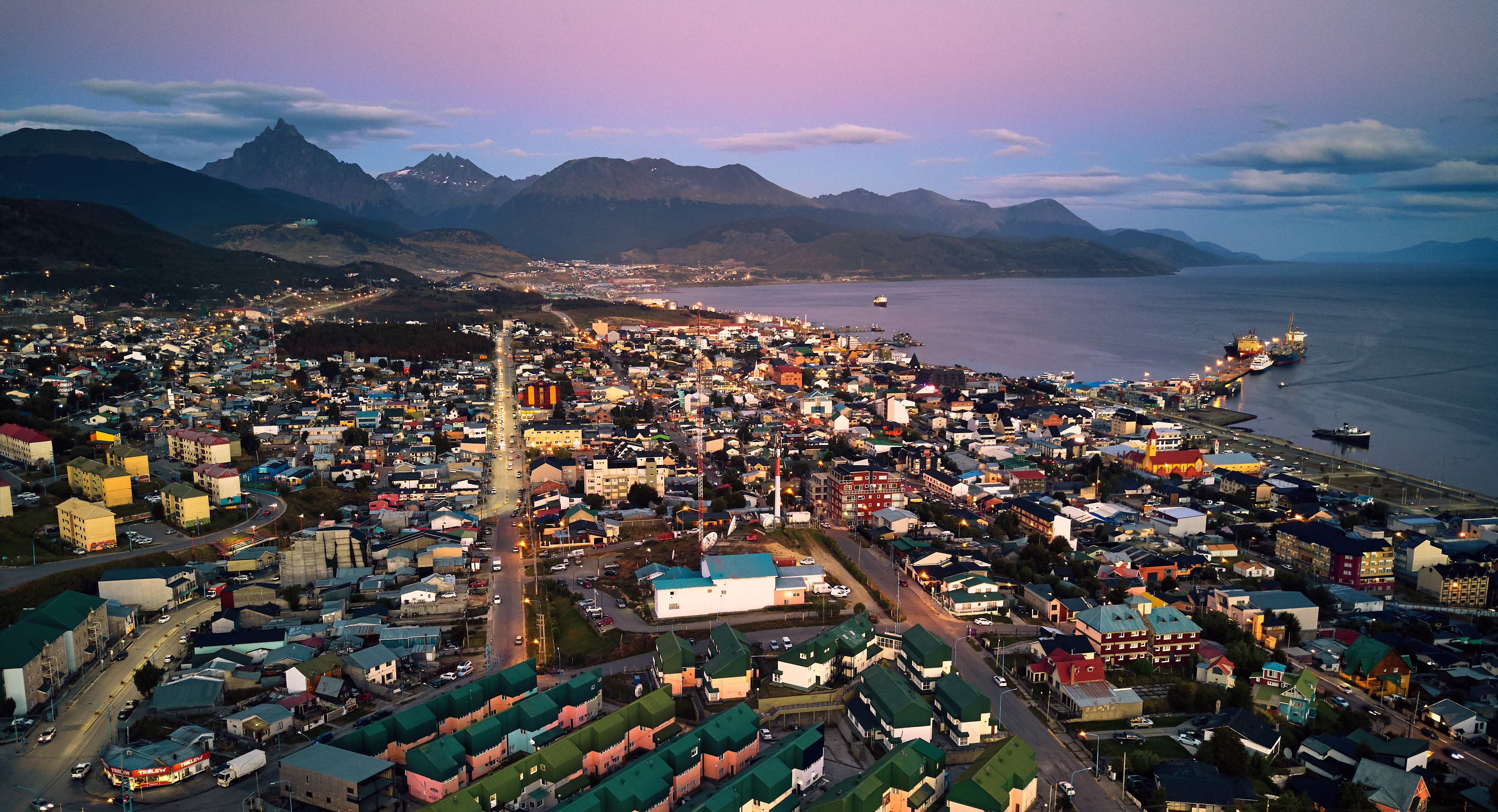 The port of Ushuaia, capital of Argentina's Tierra del Fuego Province on the southern coast of Isla Grande, bounded by the Martial mountain range to the north and the Beagle Channel to the south — host city of the Bienal del Fin del Mundo since 2007.