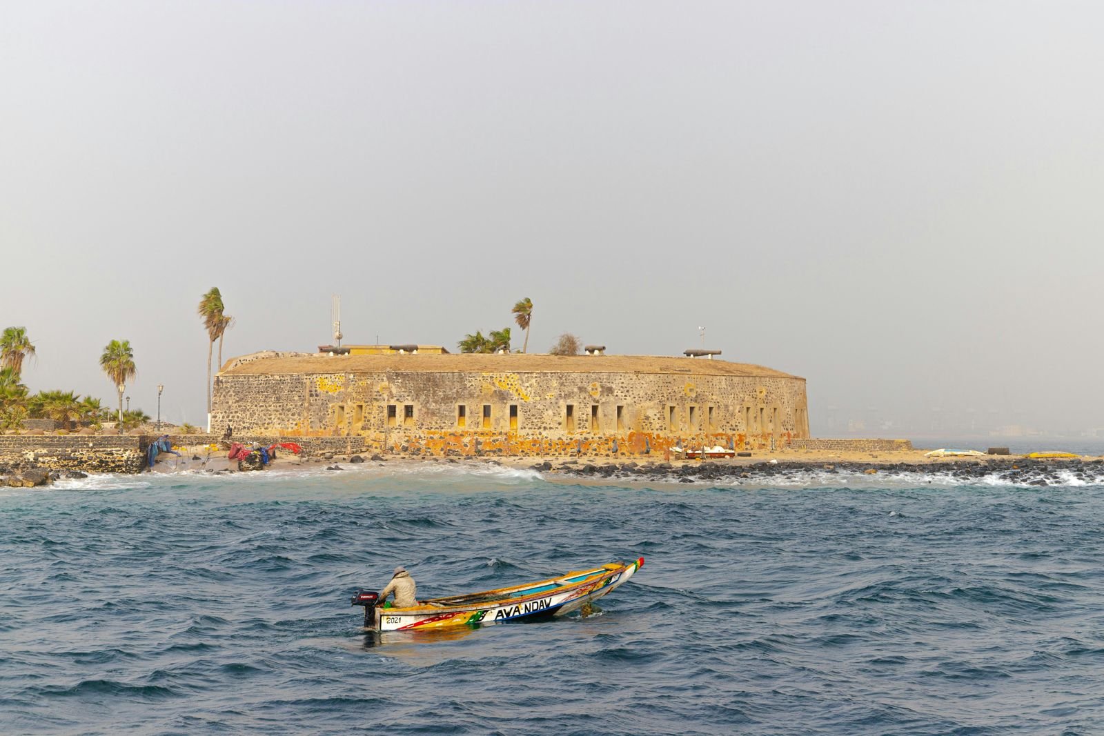 A pirogue off the fort on the Île de Gorée